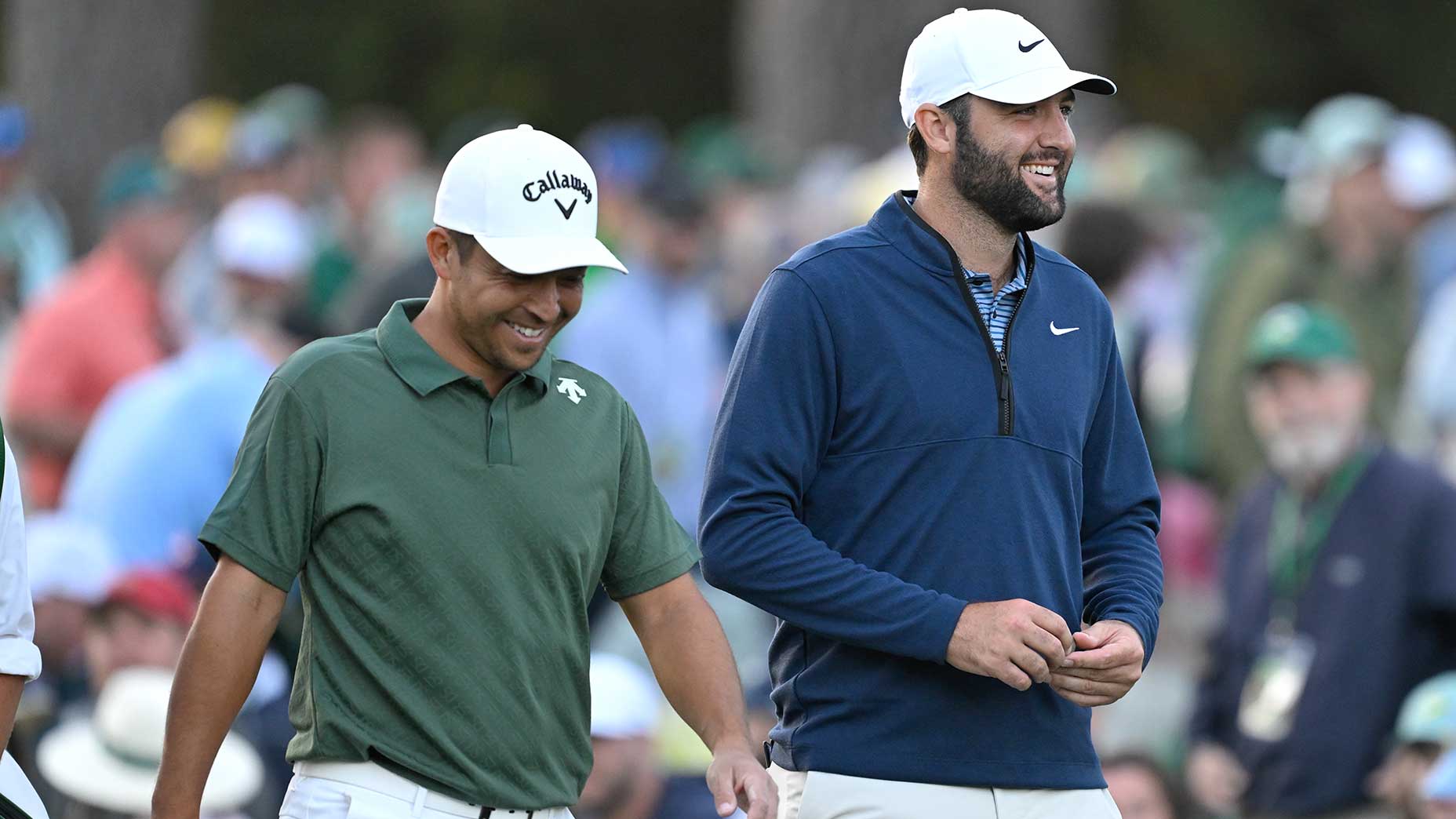 xander schauffele and scottie scheffler walk down the fairway