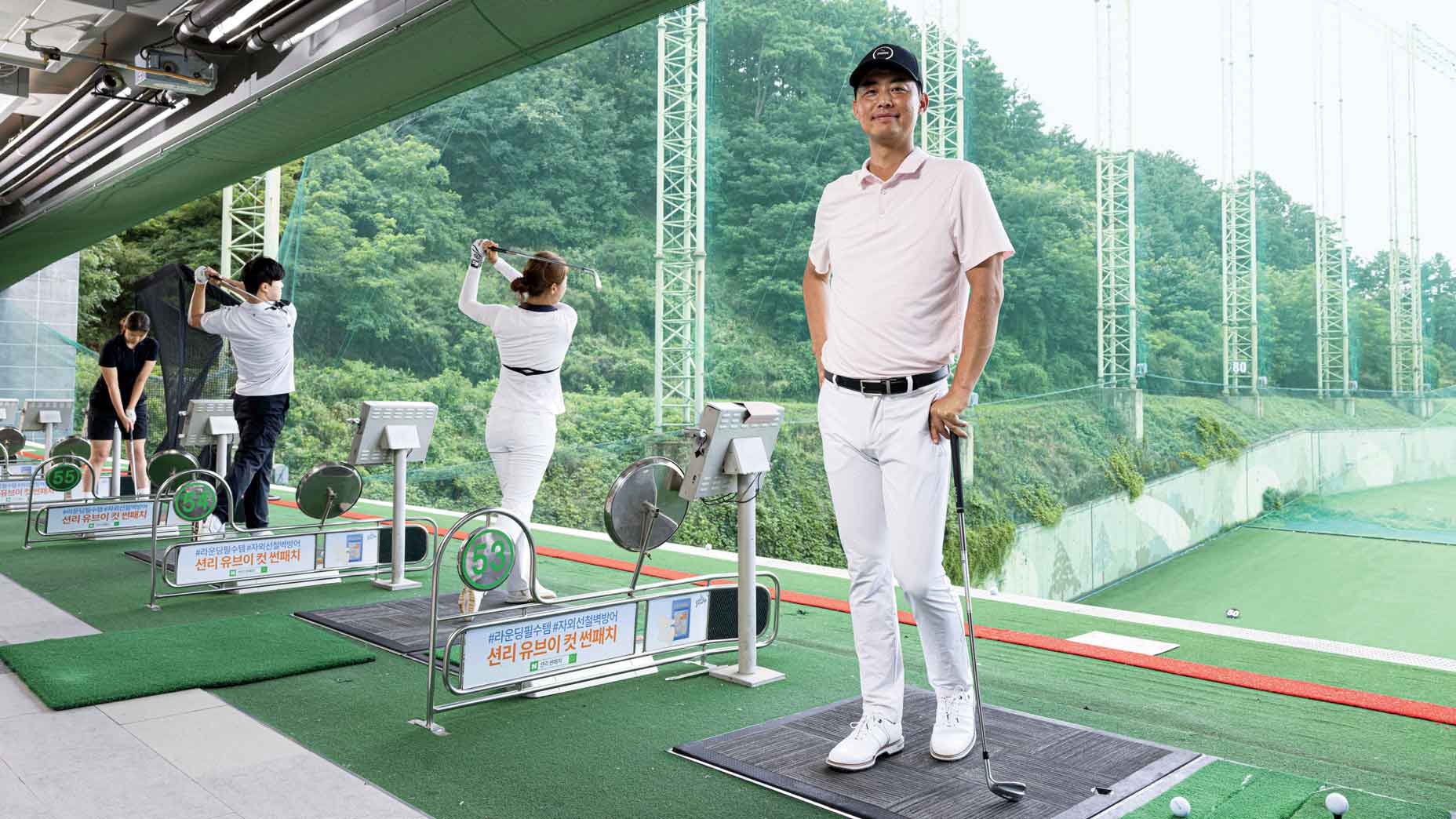 instructor Austin Na (Kevin&rsquo;s bro) with students at the Team Na Golf Acad- emy in Yongin, a suburb of Seoul.