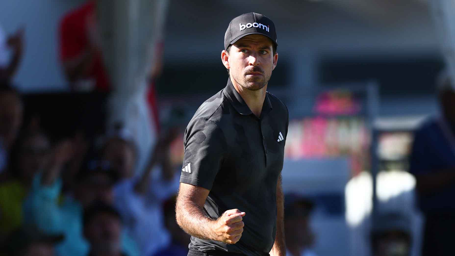 nick taylor pumps fist in black shirt and hat at the 2025 Sony Open