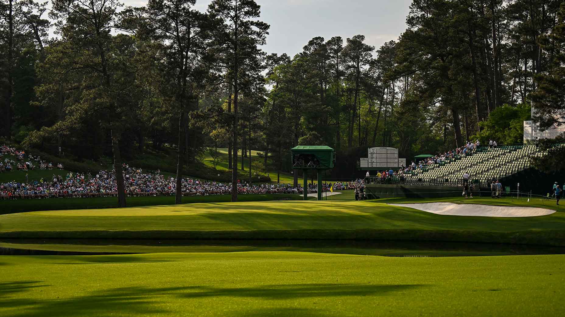 a scenic shot of the 15th hole at Augusta National at the Masters Tournament.