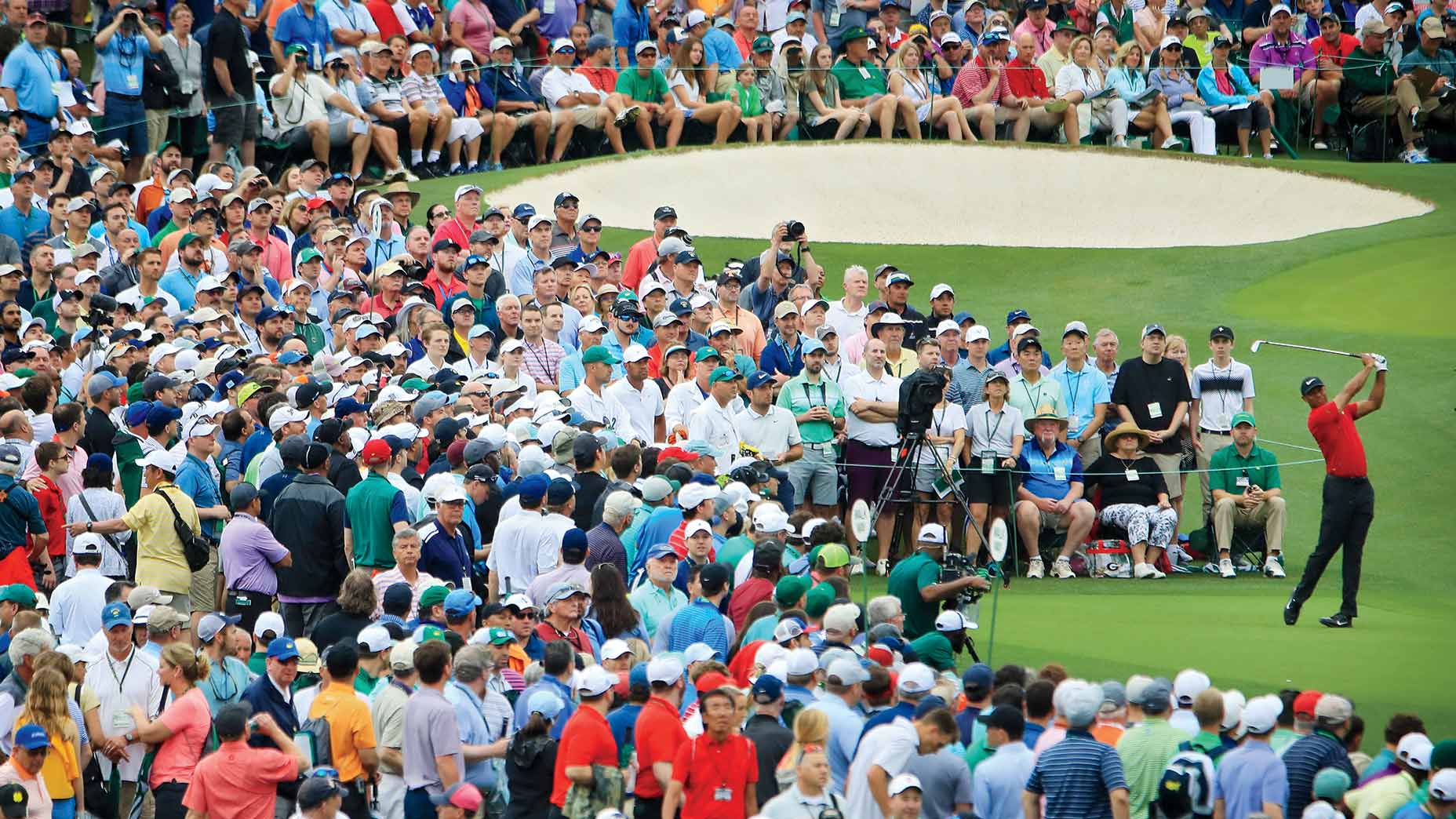tiger woods tees off at the masters