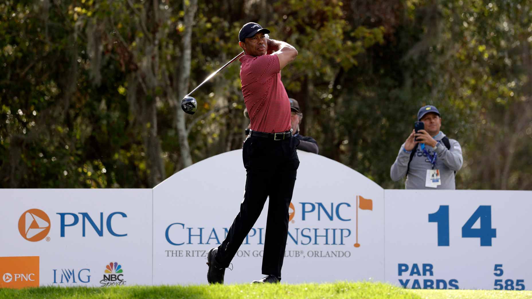Tiger Woods plays his shot from the 14th tee during the second round of the PNC Championship at Ritz-Carlton Golf Club.
