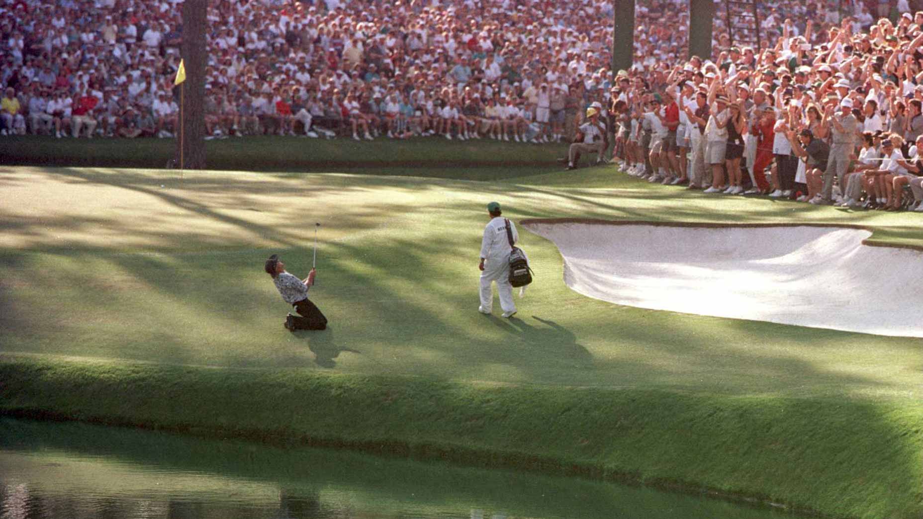 Greg Norman of Australia sinks to his knees on the 15th green after narrowly missing the hole with his chip shot during the final round of the 1996 Masters at Augusta National Golf Club in Augusta, Georgia.