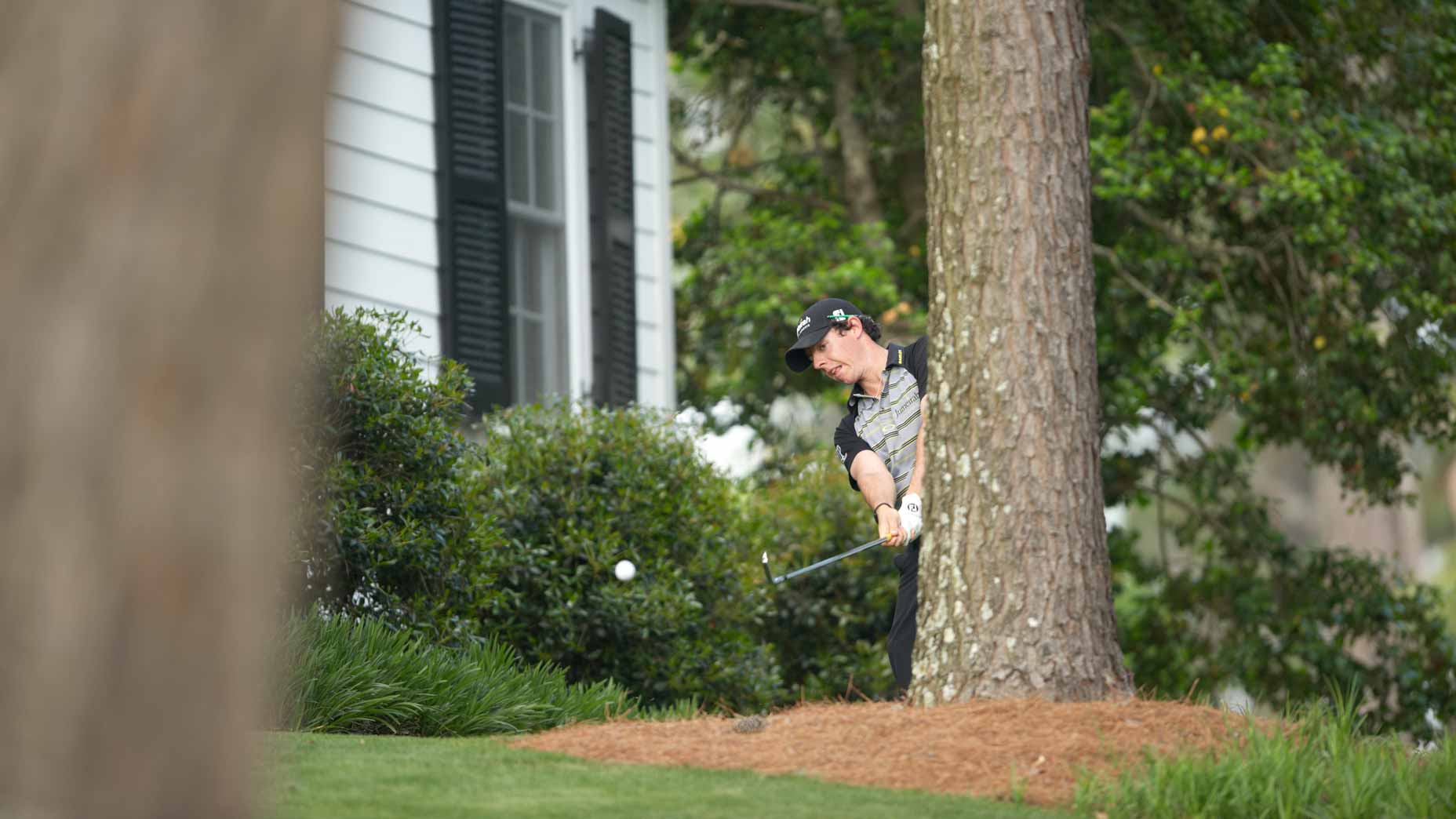 Rory McIlroy in action from rough on Sunday at Augusta National.