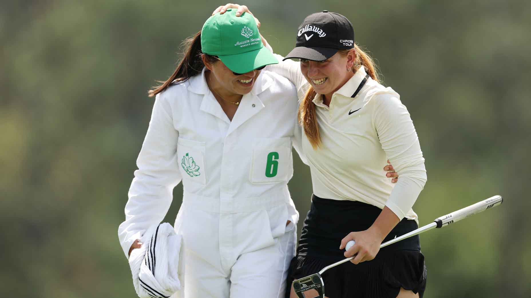carla bernat escuder hugs her caddie after winning the augusta national womens amateur
