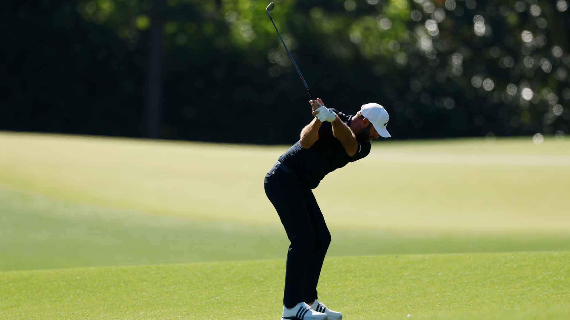 dustin johnson swings wedge during 2025 masters tournament