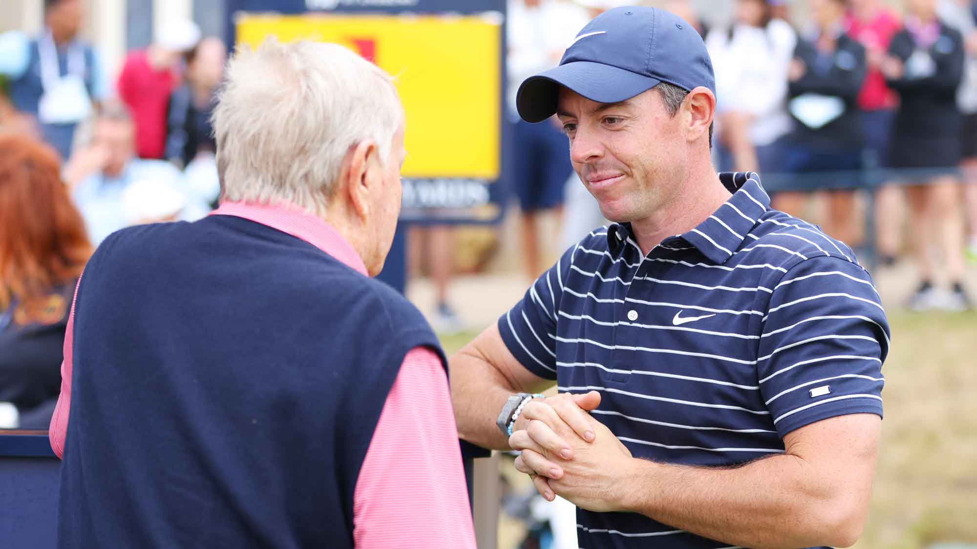 Jack Nicklaus speaks with with Rory McIlroy of Northern Ireland on the first tee during the Celebration of Champions prior to The 150th Open at St Andrews Old Course