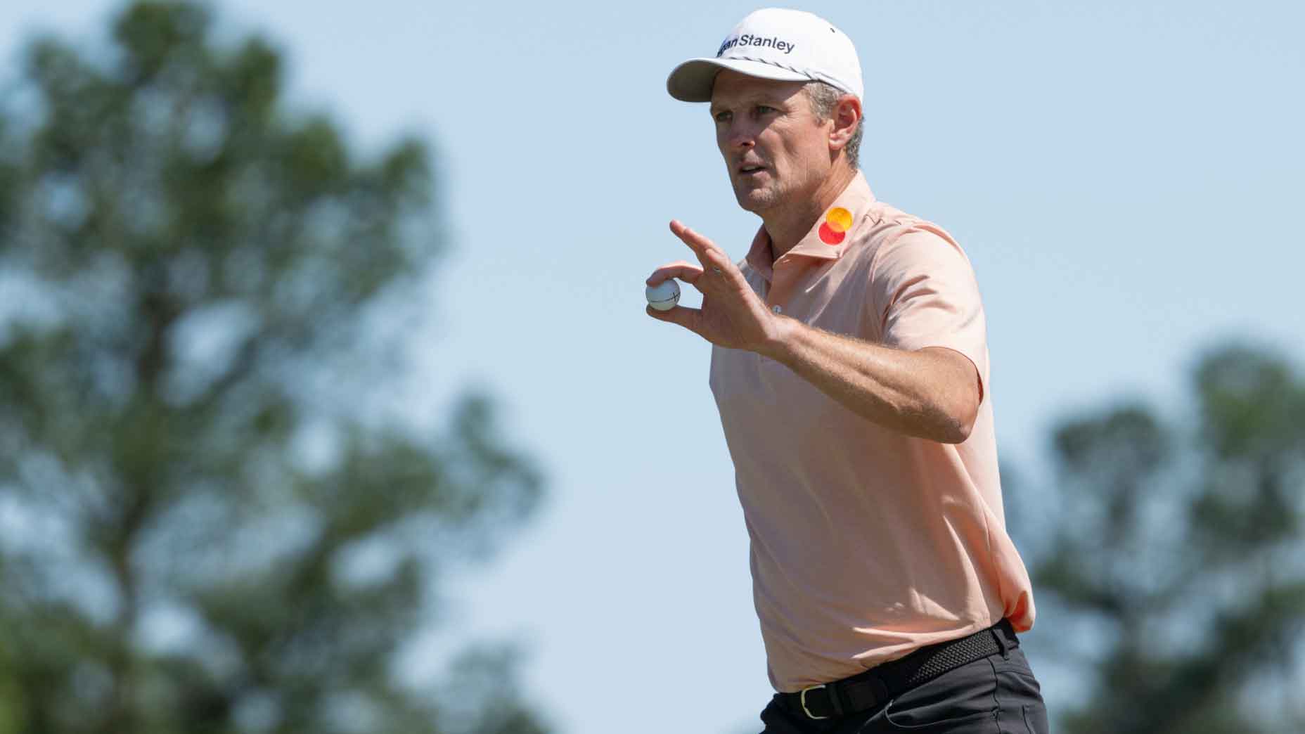 justin rose waves to the crowd during the final round of the 2025 masters