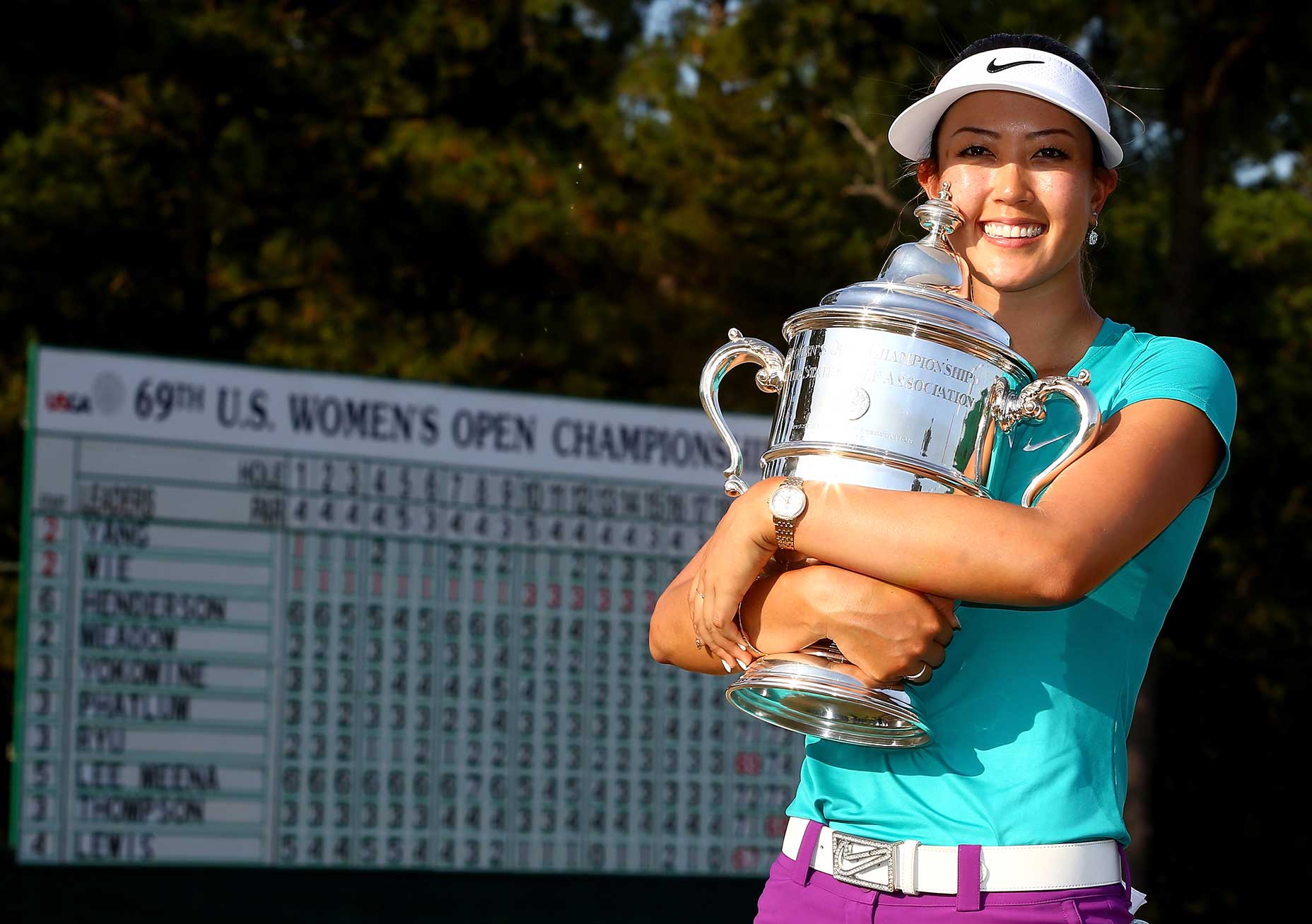 Michelle Wie celebrates with the trophy after winning in the final round of the 69th U.S. Women's Open at Pinehurst
