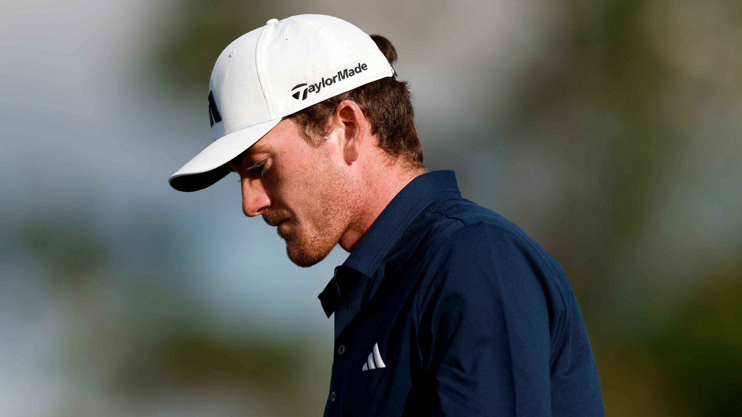 Nick Dunlap of the United States reacts after a putt on the 18th hole during the second round of the 2025 Masters Tournament