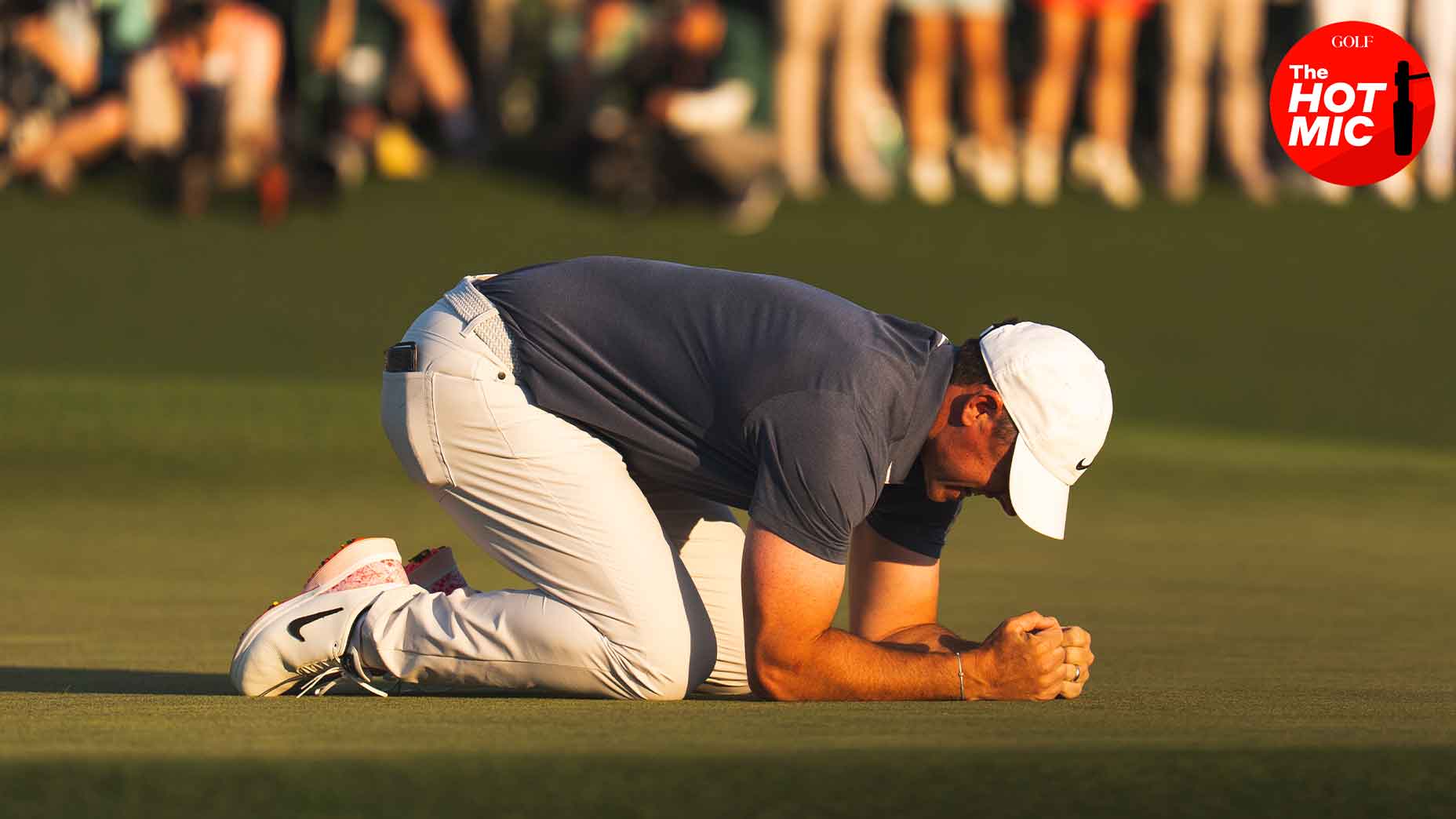 rory mcilroy crouches at the masters in celebration after victory at augusta national