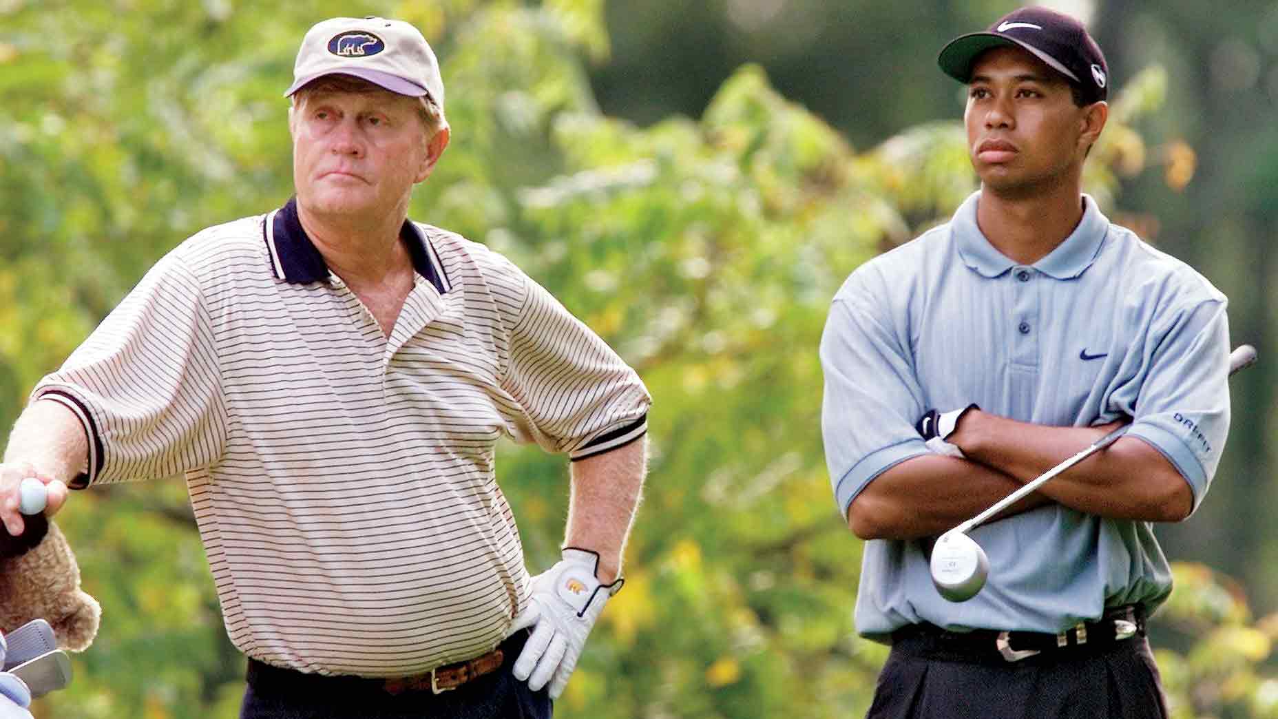Golf legend Jack Nicklaus (L) and Tiger Woods (R), both of the US, stand on the second tee waiting to tee off 17 August, 2000 during the first round of the 82nd PGA Championship at Valhalla Golf Club in Louisville, KY. Woods is trying to become the first player since Ben Hogan in 1953 to win three majors in one season. (ELECTRONIC IMAGE) AFP PHOTO/Jeff HAYNES (Photo credit should read JEFF HAYNES/AFP via Getty Images)