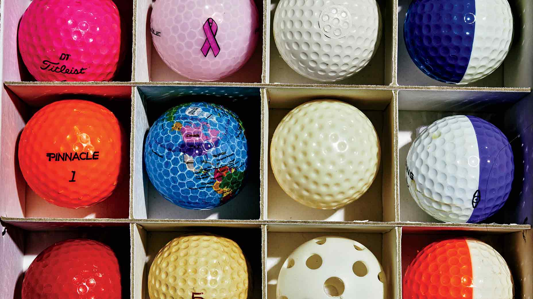 Merion-logoed balls from USGA championships, rare PING models and plastic practice balls and floaters.