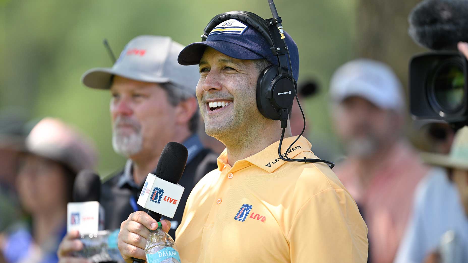 Adam Schefter calls the actions during the first round of the Travelers Championship at TPC River Highlands on Thursday.