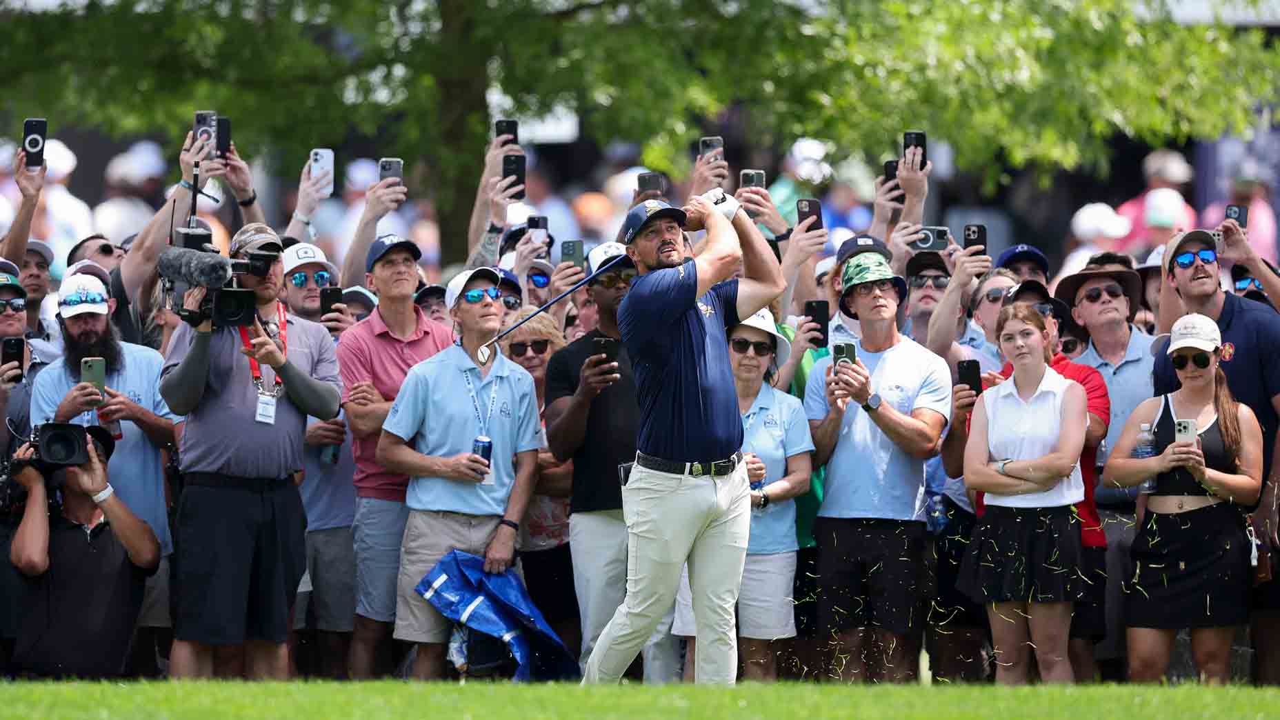 Bryson DeChambeau hits a shot during golf tournament