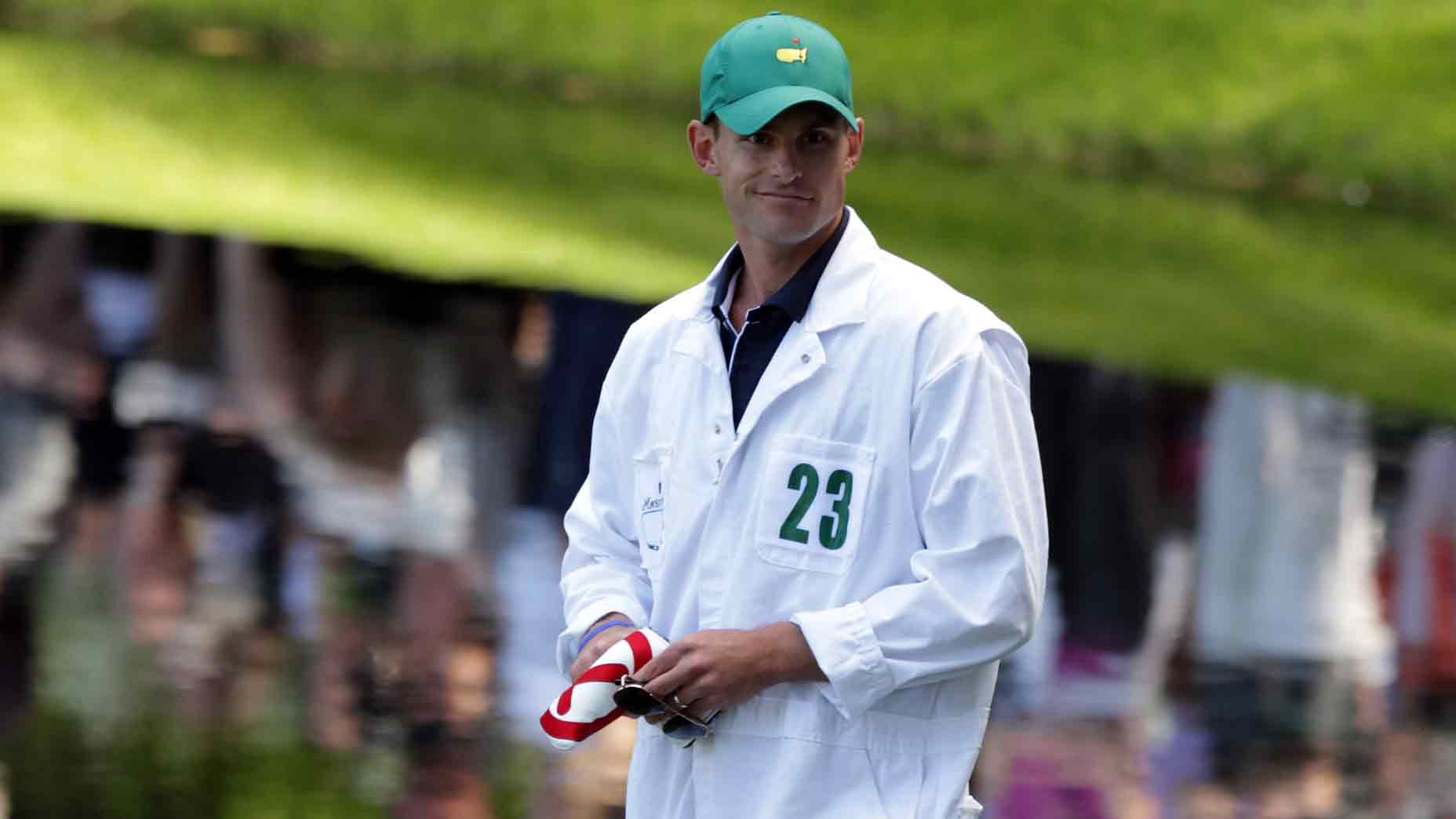 Andy Roddick caddies for Zach Johnson during the Par 3 Contest prior to the 2011 Masters Tournament at Augusta National Golf Club on April 6, 2011 in Augusta, Georgia.