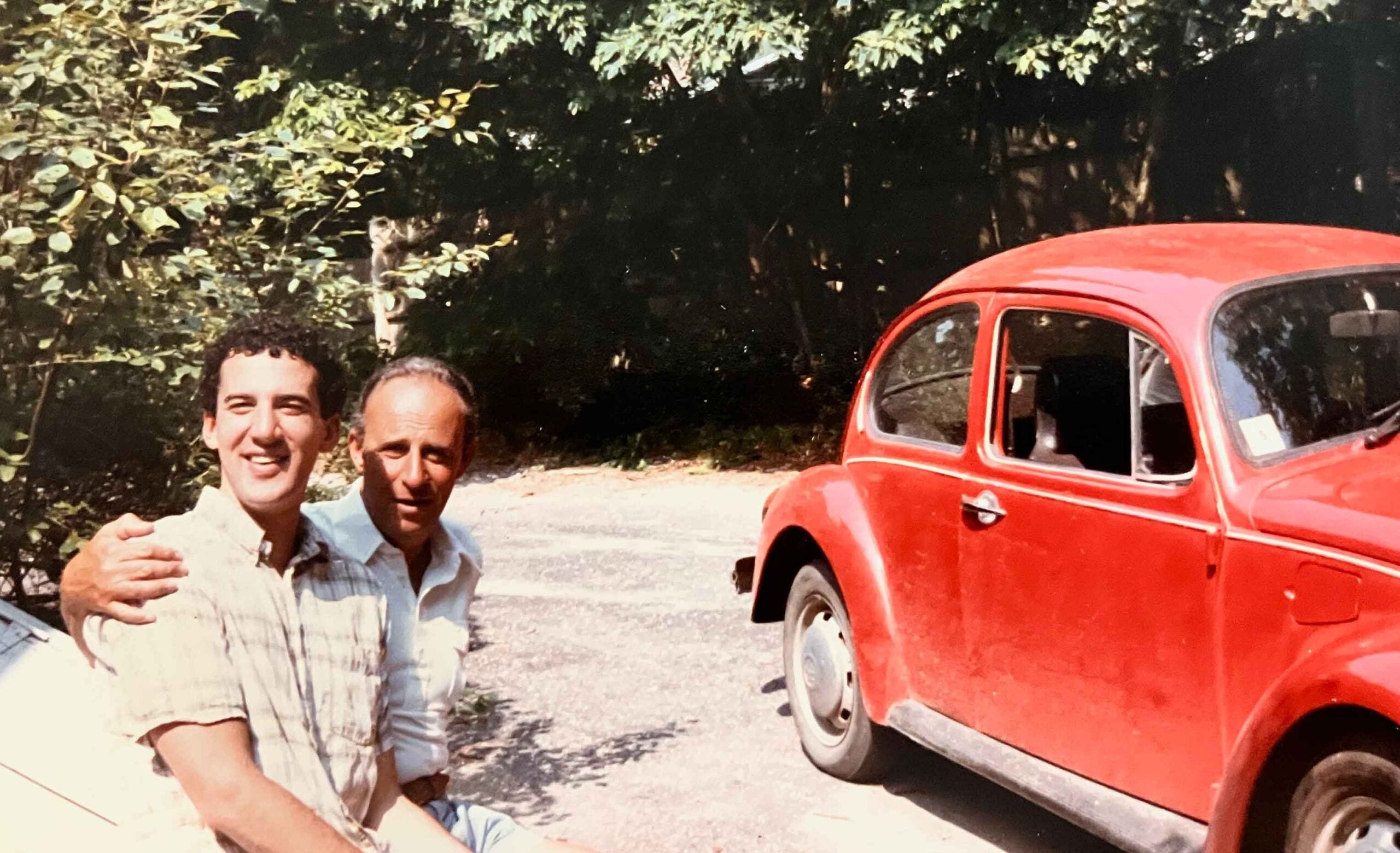 michael bamberger and his father next to red mini