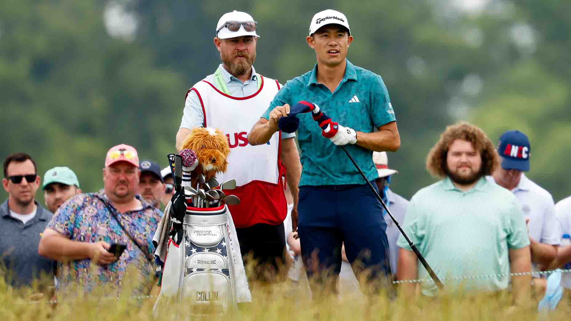 Collin Morikawa and caddie Joe Greiner talk over a shot at the 2025 U.S. Open