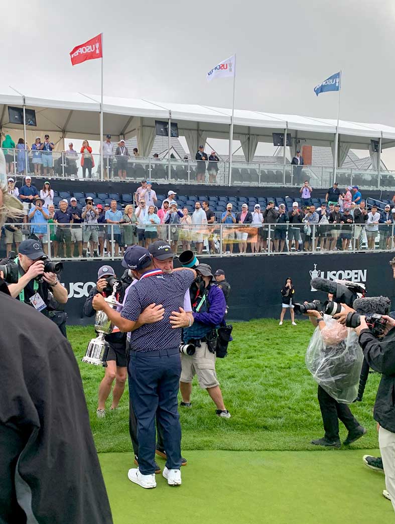 J.J. Spaun hugs his dad, John, after winning the U.S. Open on Sunday.