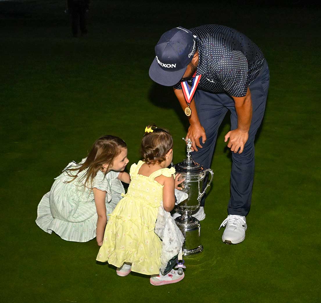 J.J. Spaun's daughters inspect their dad's newest hardware.