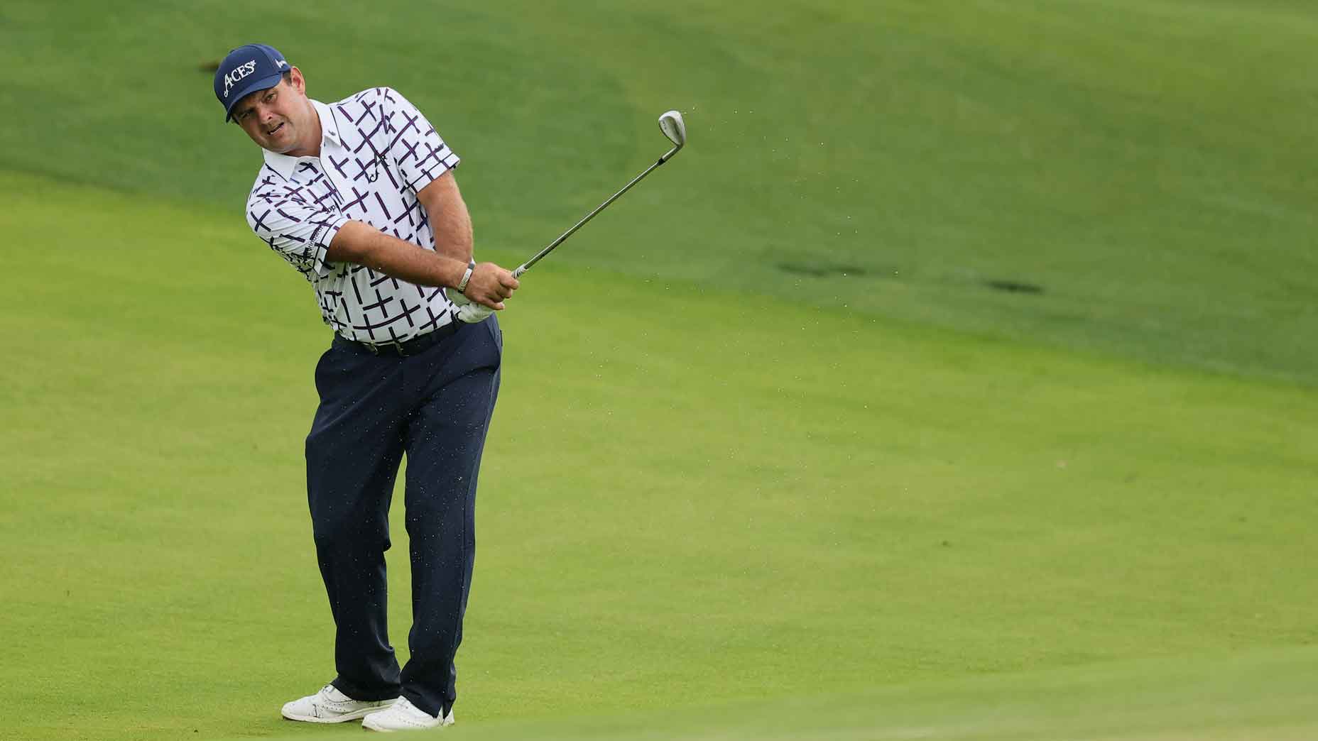 patrick reed hits chip shot ahead of the 2025 pga championship