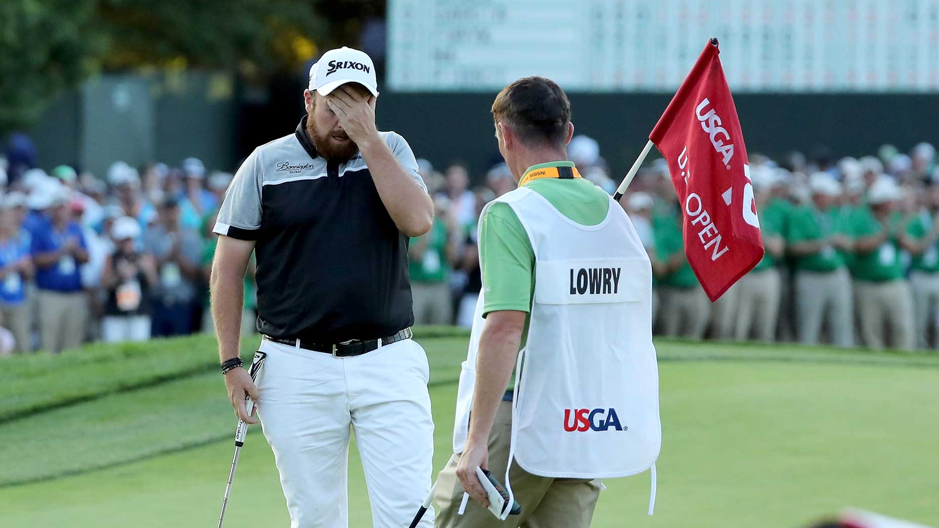 Shane Lowry hides his face after completing his round on the 18th hole during the final round of the 2016 U.S. Open at Oakmont