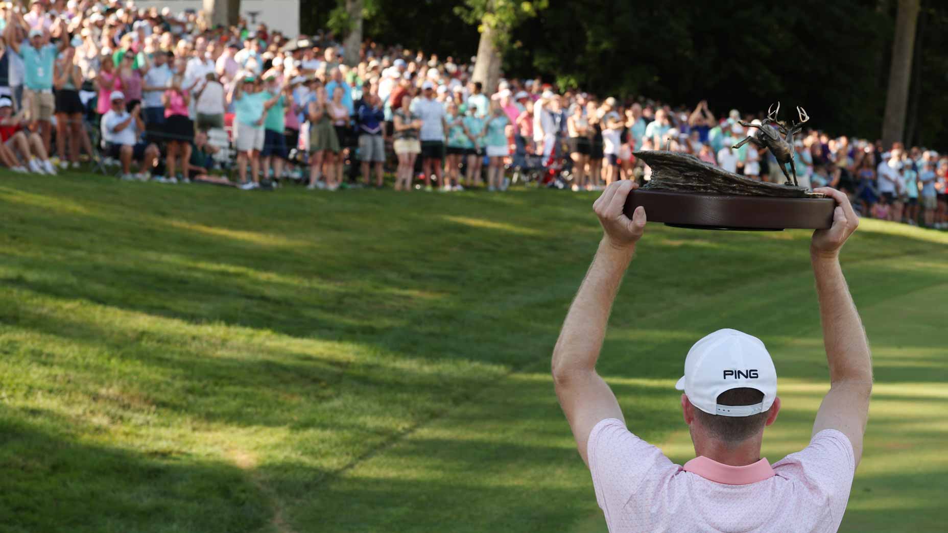 Brian Campbell raised the trophy towards fans at the John Deere Classic.