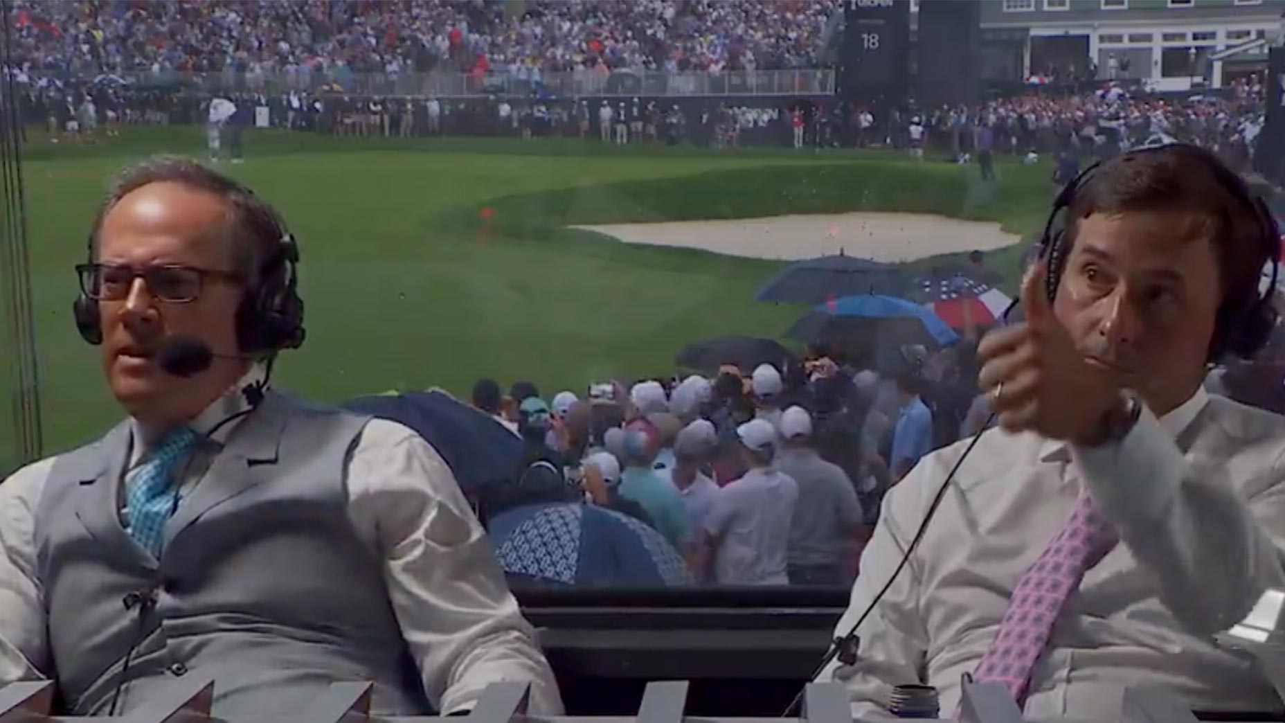 kevin kisner gives thumbs up from u.s. open booth seated next to dan hicks in suit and tie