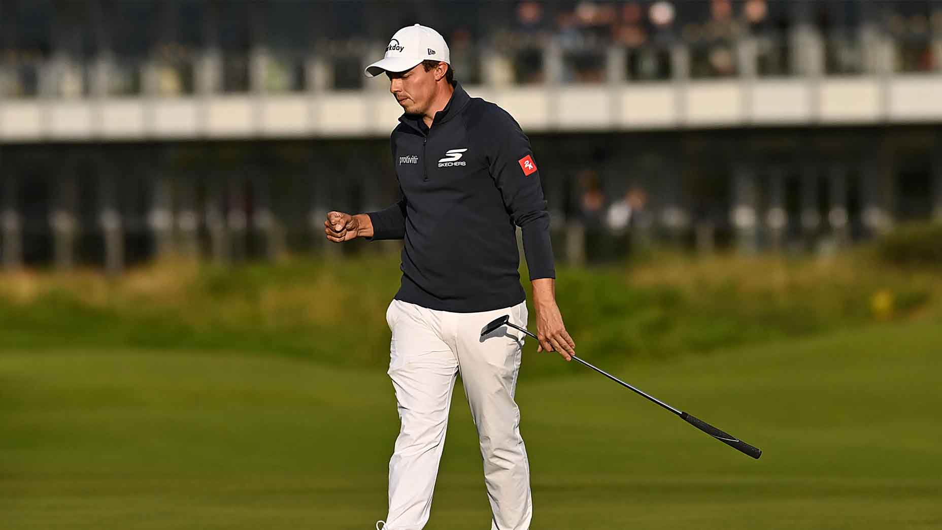 Matt Fitzpatrick celebrates holing a putt during the 2025 Open Championship