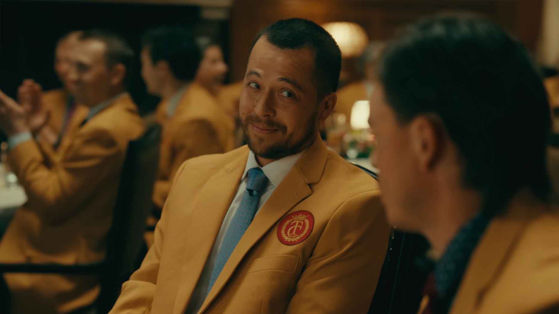 Xander Schauffele smiles during a scene in Happy Gilmore 2