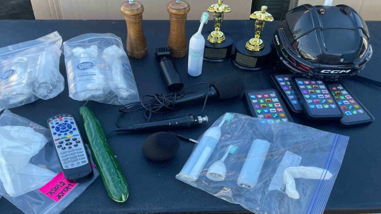 various props from happy gilmore laid out on table