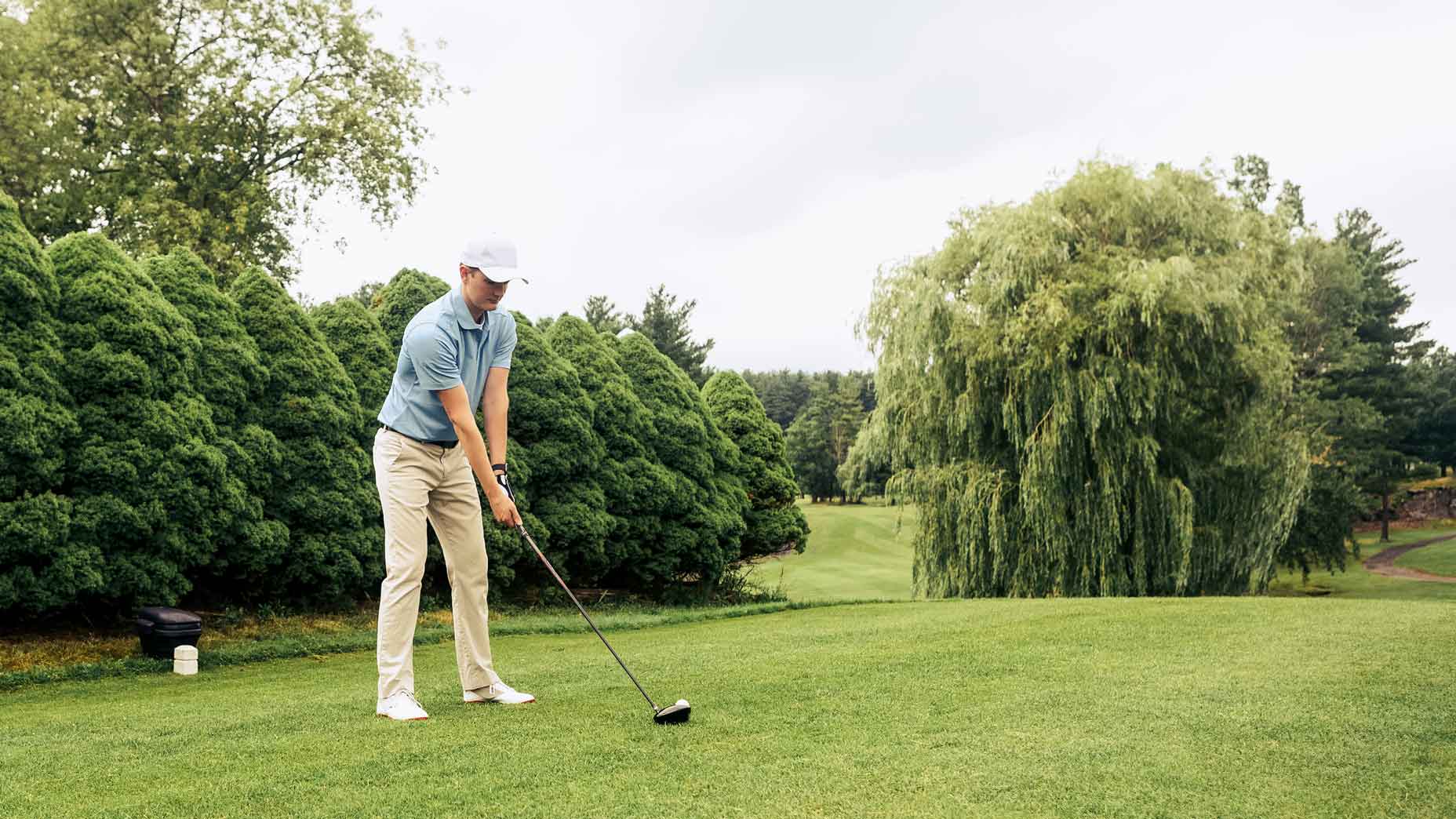 Golfer about to hit driver off the tee