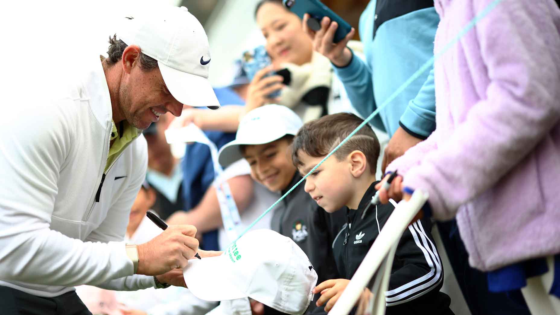 Rory McIlroy of Northern Ireland signs autographs for fans following the Pro-Am of the RBC Canadian Open at Oakdale Golf and Country Club on June 07, 2023 in Toronto, Ontario, Canada