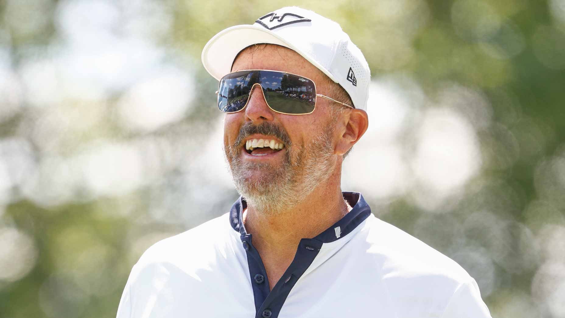 LIV pro Phil Mickelson smiles during Day 1 of LIV Michigan team championship.