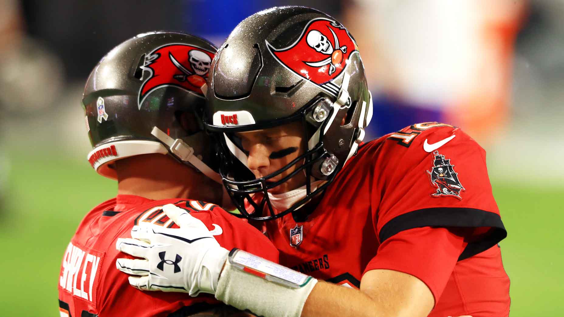A.Q. Shipley #62 of the Tampa Bay Buccaneers talks with Tom Brady #12 before the game against the New Orleans Saints at Raymond James Stadium on November 08, 2020 in Tampa, Florida. (