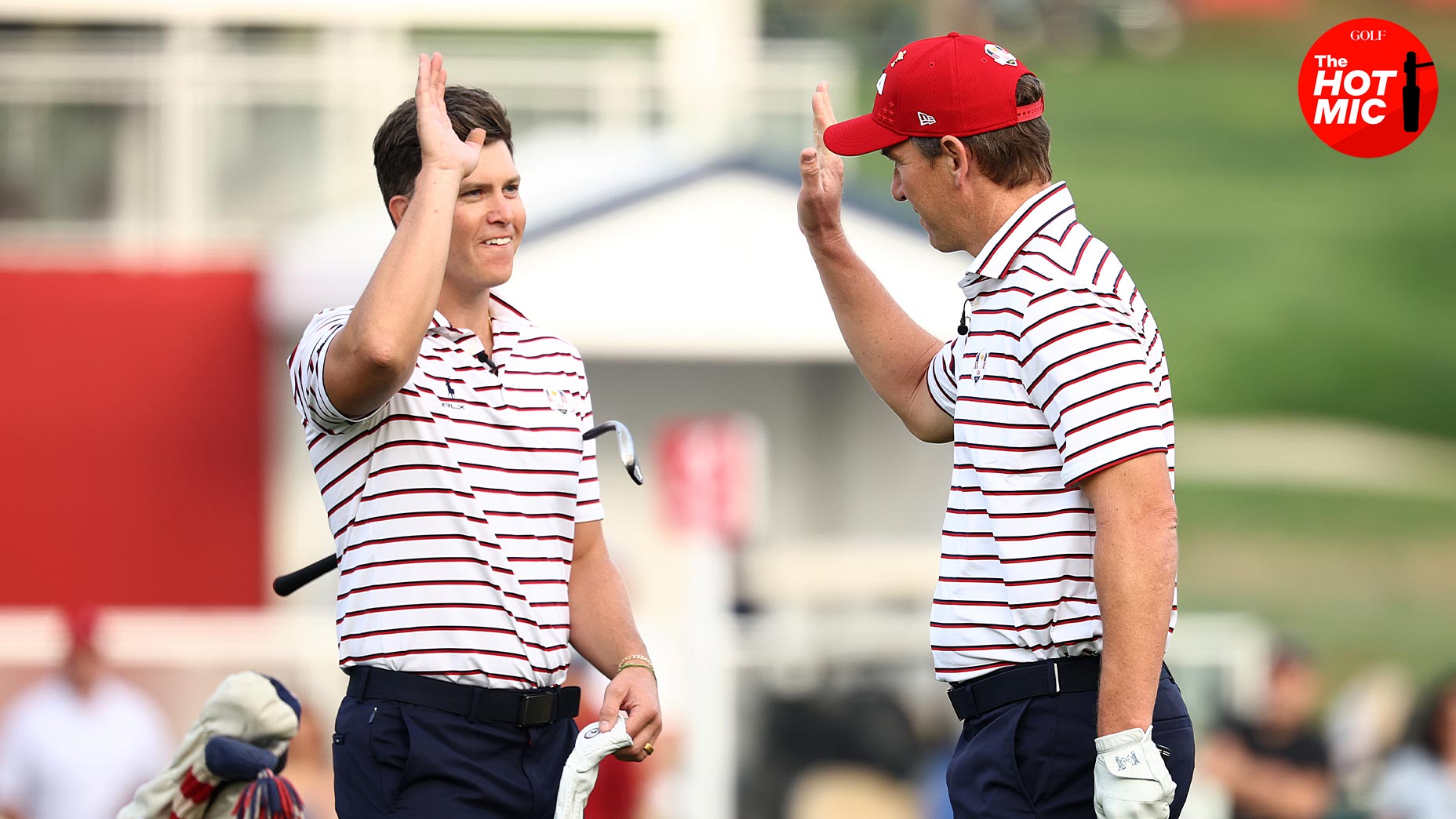 colin jost and eli manning high five at Ryder Cup celebrity match at bethpage black