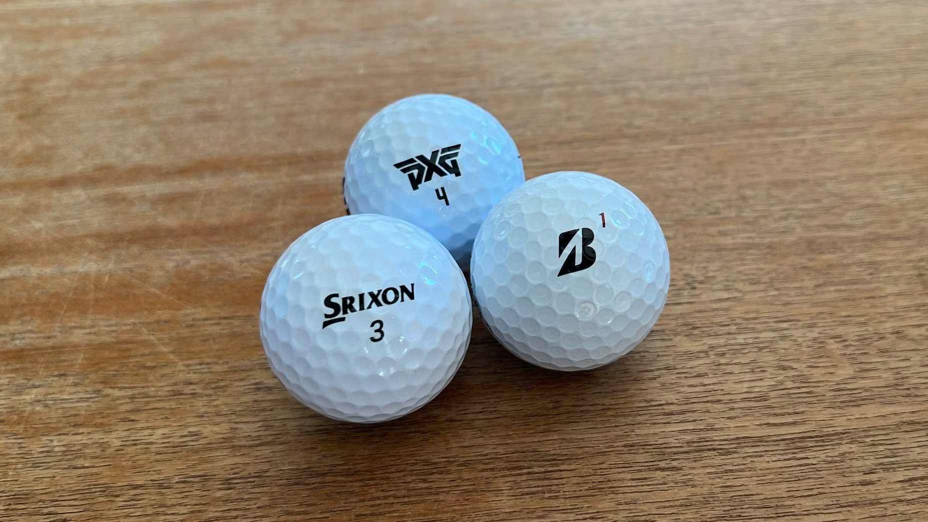 Golf balls under 40 dollars arranged on a desk