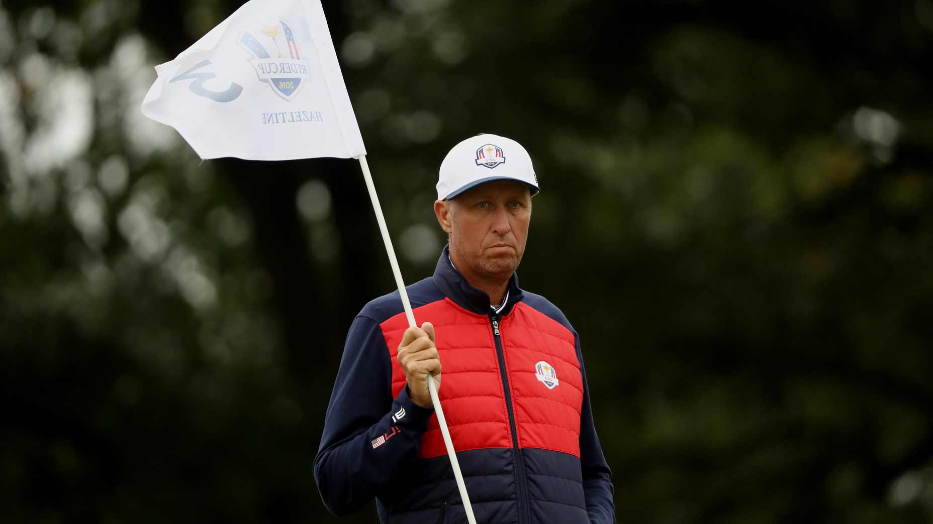 Jim Mackay as Ryder Cup caddie holds a flag during the 2016 Ryder Cup at Hazeltine.