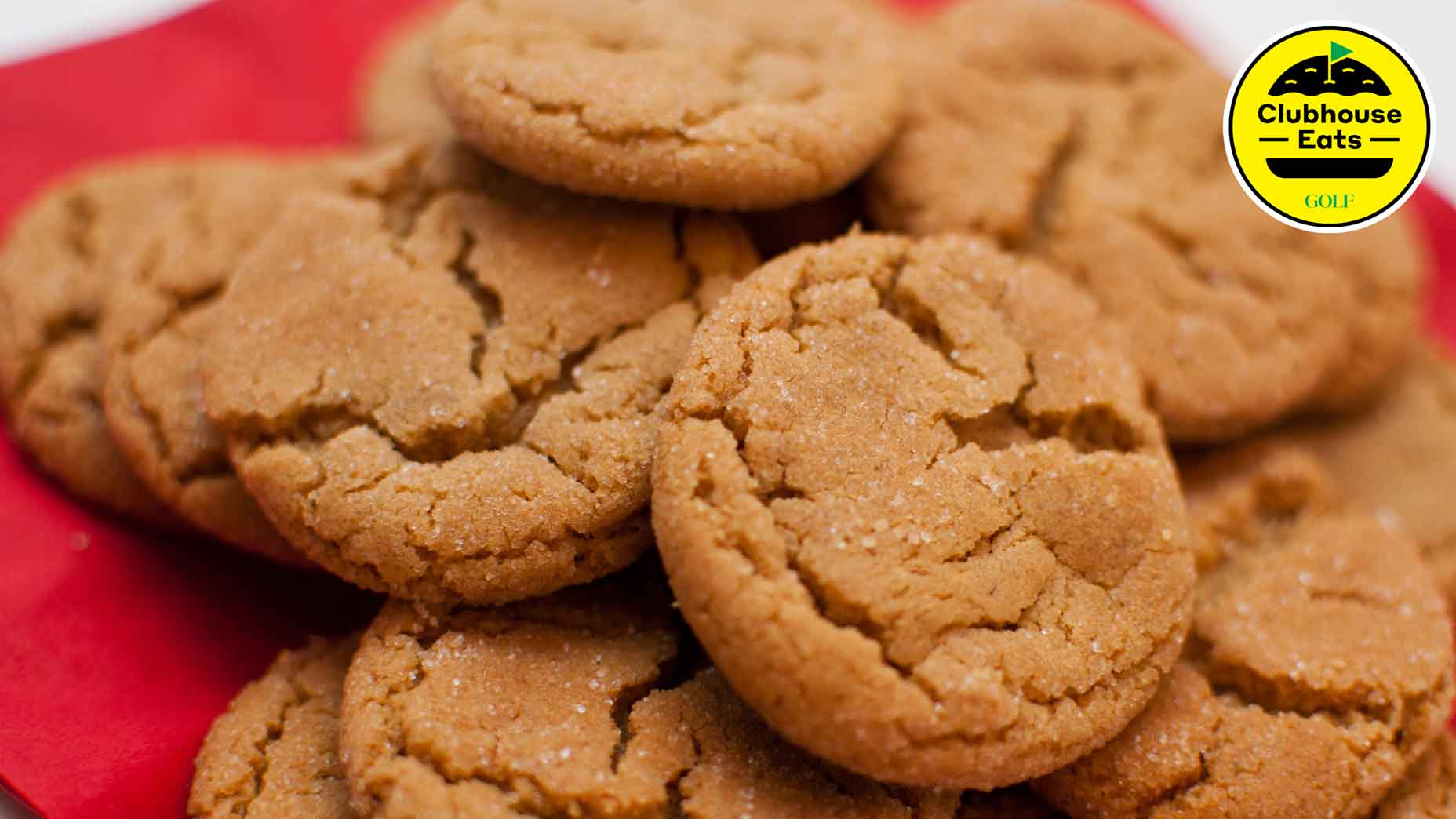 A group of homemade ginger snap cookies on a plate. Shallow DOF.