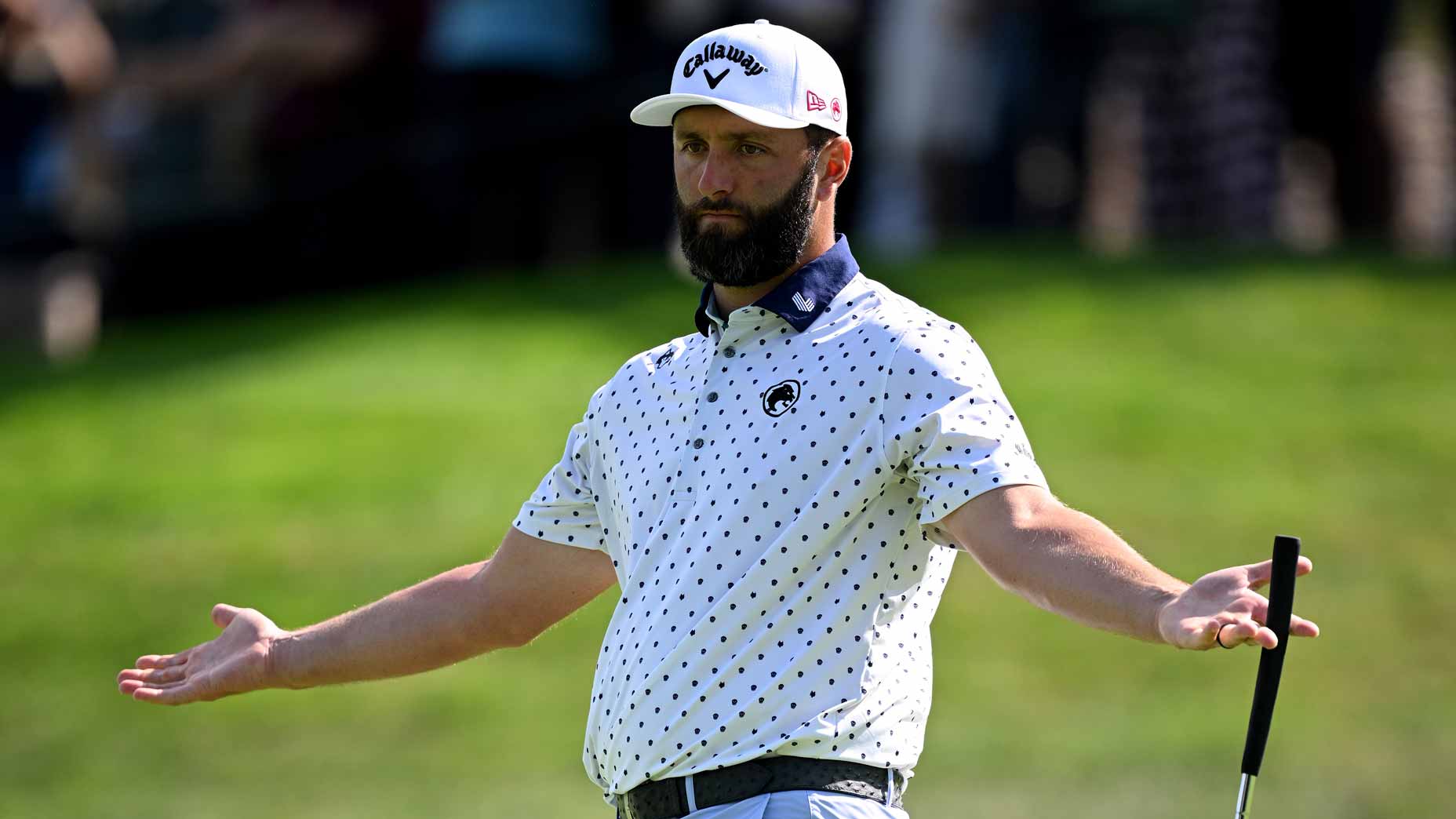 Jon Rahm gestures with open arms during the 2025 Open de Espana.