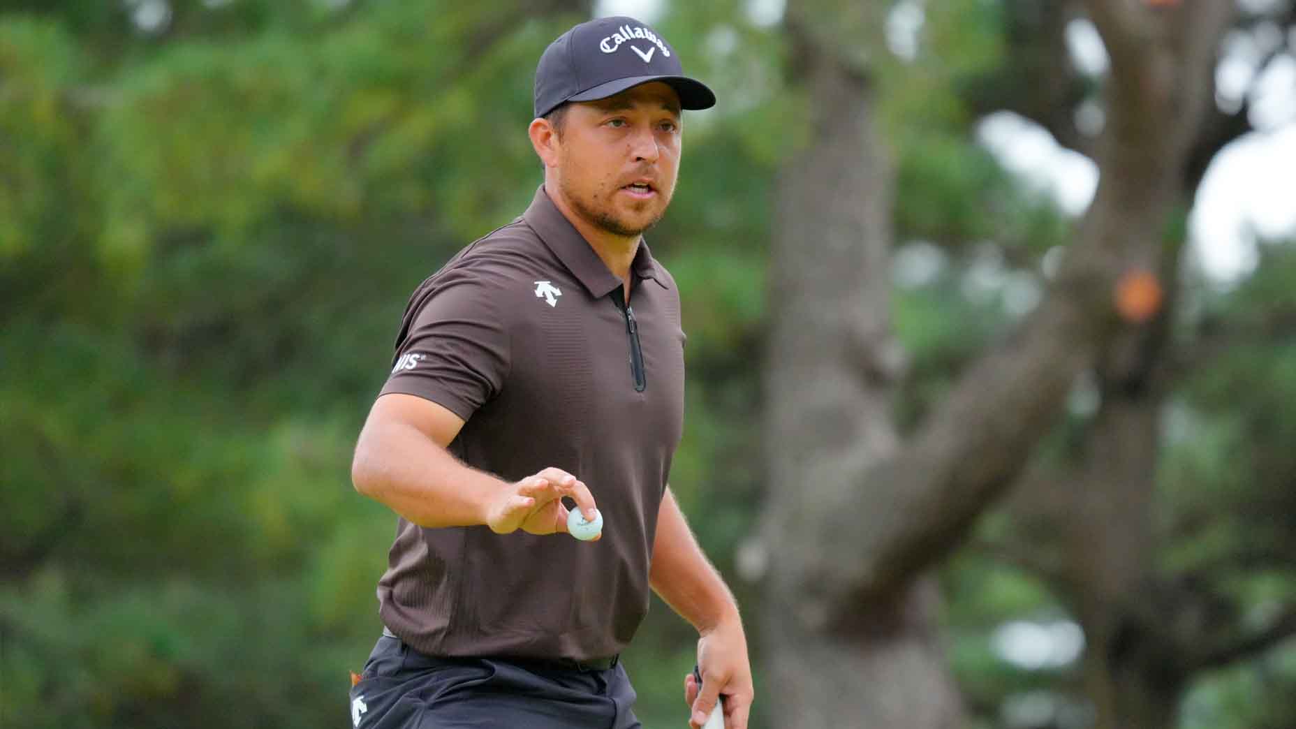 Xander Schauffele acknowledges the crowd at the Baycurrent Classic