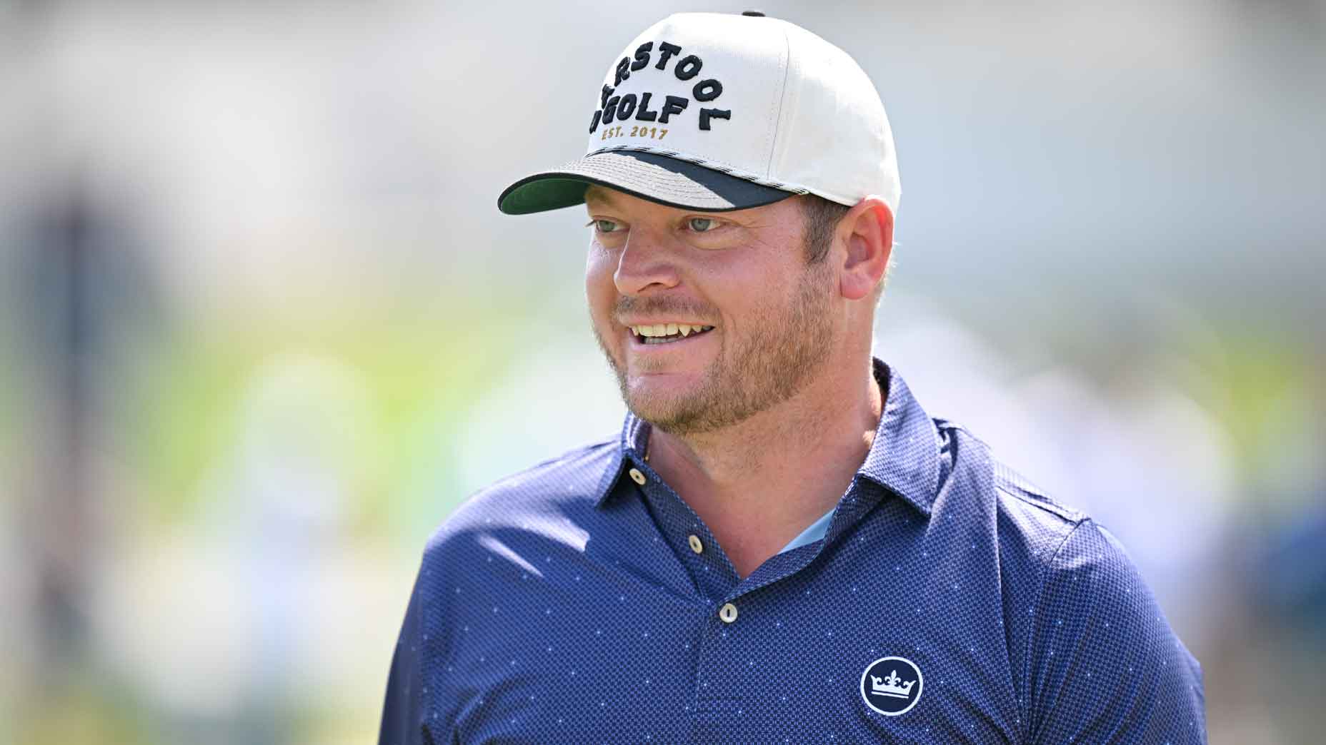 Sam Bozoian, known as "Riggs" warms up on the driving range prior to TOUR Championship at East Lake Golf Club on August 28, 2024 in Atlanta, Georgia.