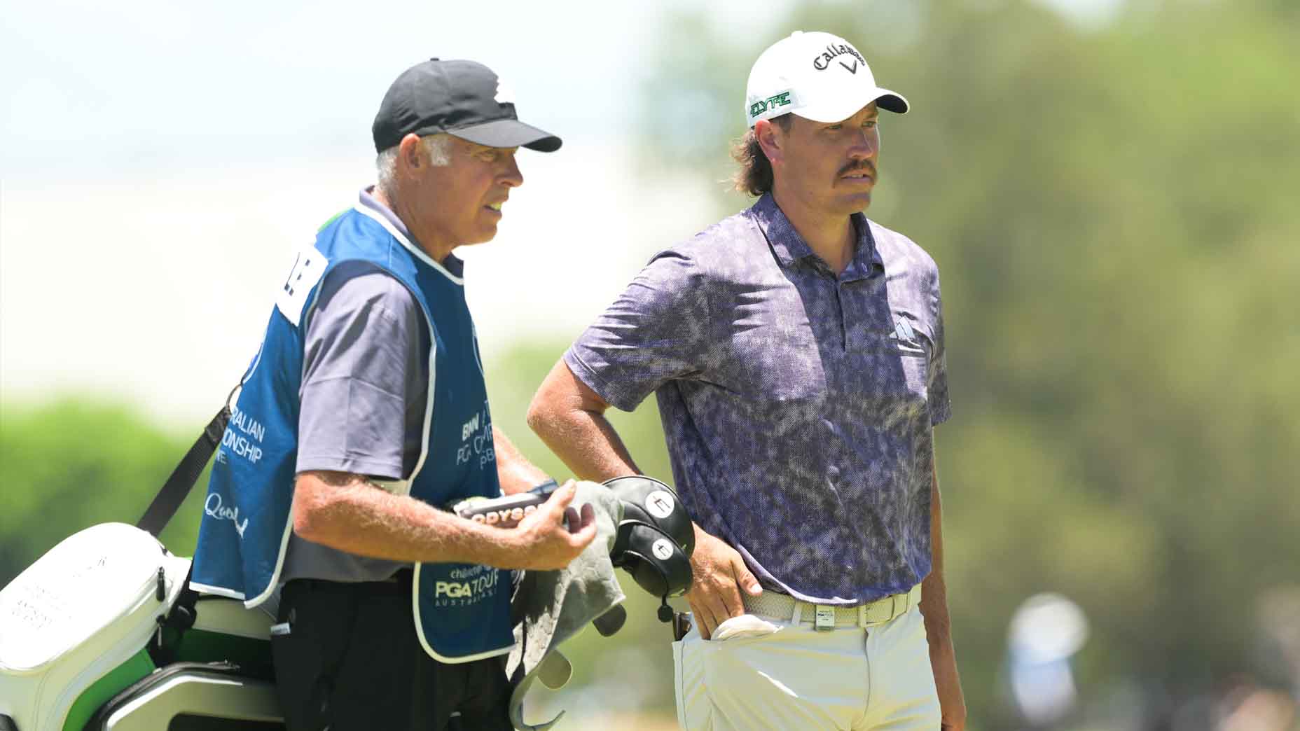 Anthony Quayle and caddie Steve Williams look on during the BMW Australian PGA Championship