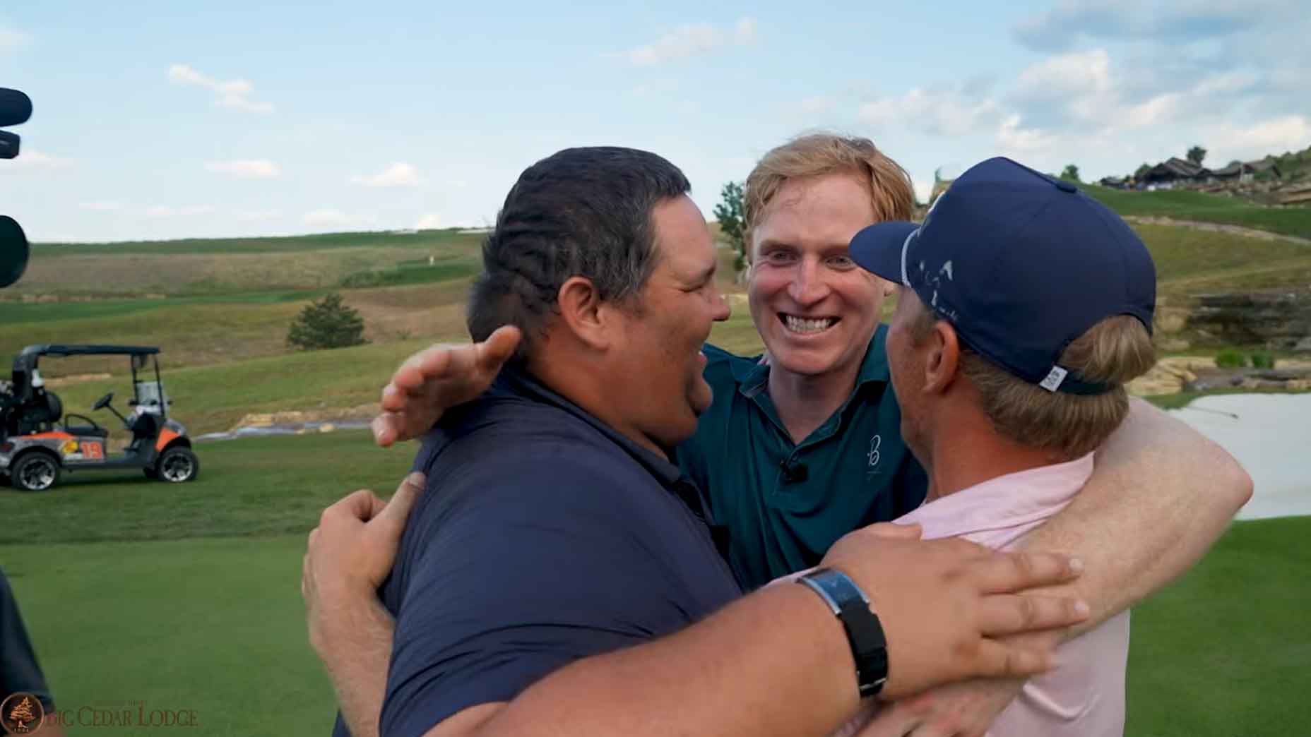 Brad Dalke (right) shares a hug with his teammates after clinching the Internet Invitational's million-dollar prize.
