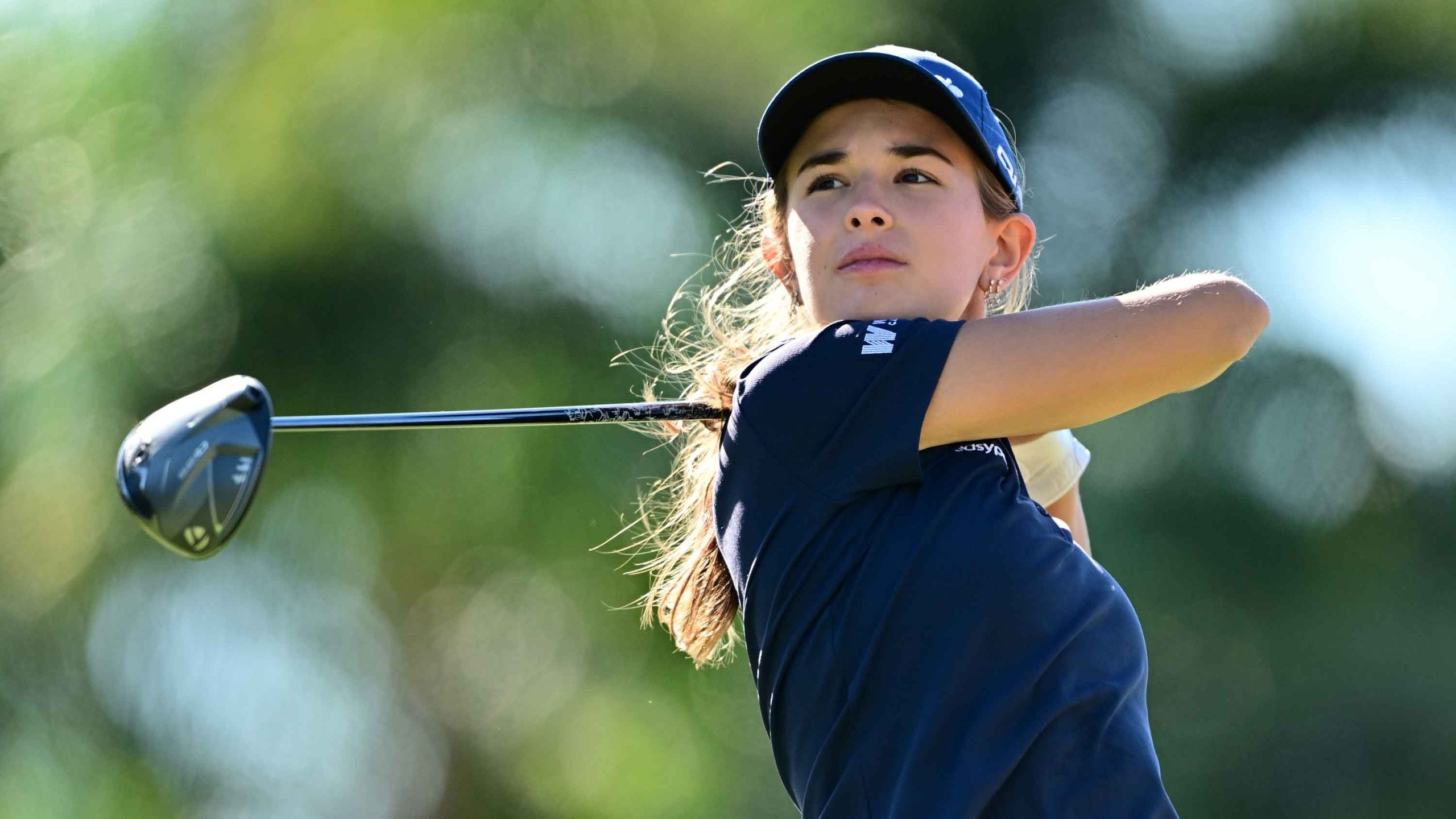 mateur Kai Trump of the United States plays her shot from the 16th tee during the first round of The ANNIKA