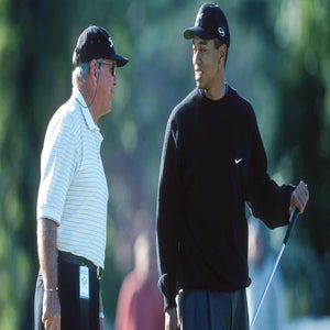 Tiger Woods of USA with his coach Butch Harmon during the Masters Golf Tournament at Augusta National Golf Club on April 5th, 2000 in in Augusta, Georgia.