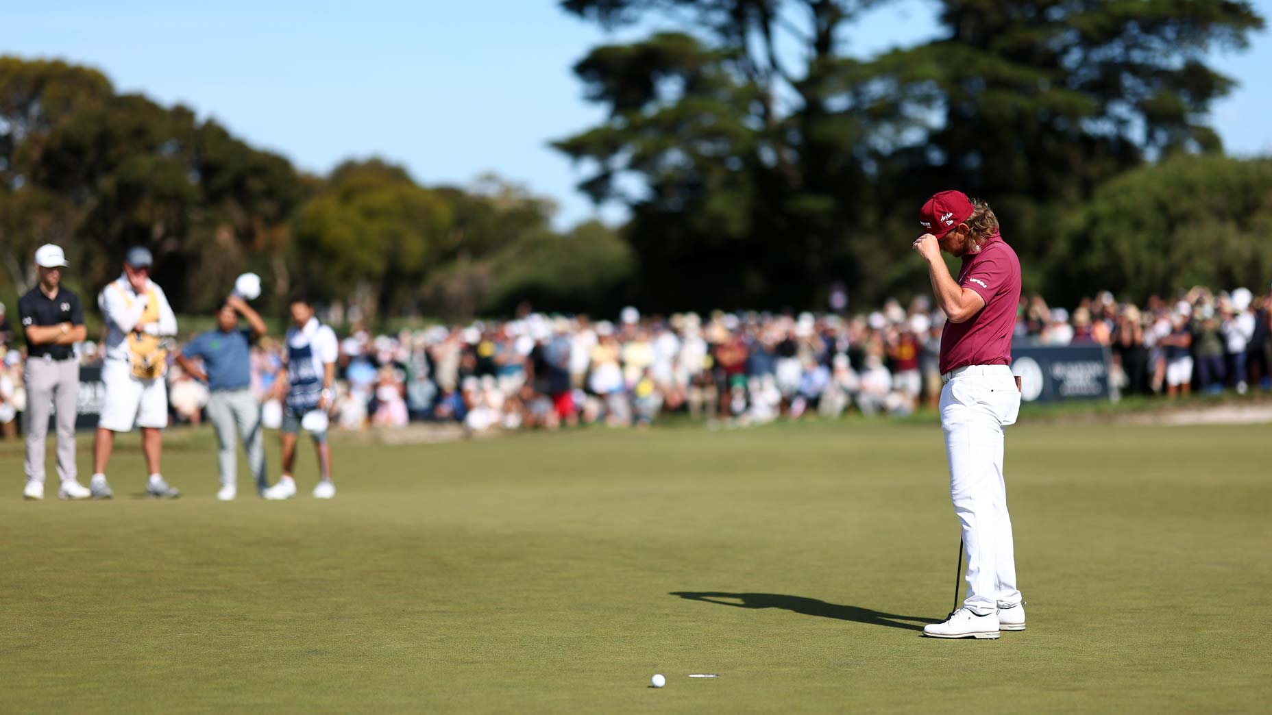 Cameron Smith's putt slid by on the 18th hole at Royal Melbourne.