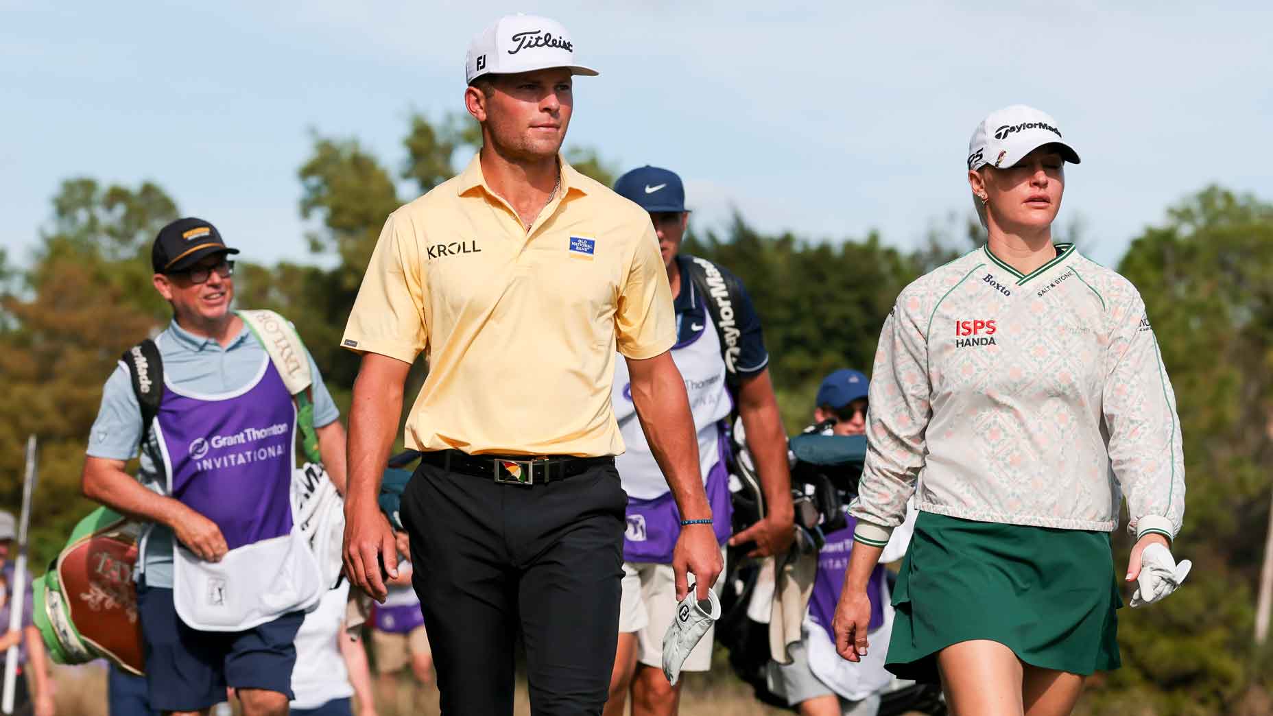 Teammates Michael Brennan of the United States and Charley Hull of England walk the 17th hole during the first round of the Grant Thornton Invitational 2025 at Tiburon Golf Club on December 12, 2025 in Naples, Florida. (Photo by Sam Navarro/Getty Images)